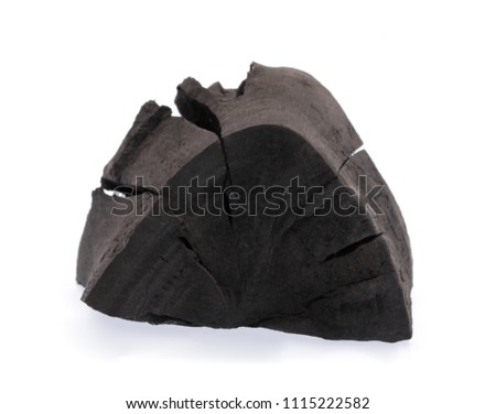 Black charcoal isolated on white background.