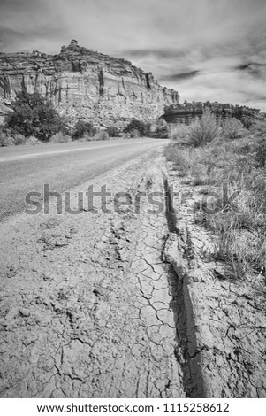 Black and white picture of a dried mud by a road, Capitol Reef National Park, Utah, USA.