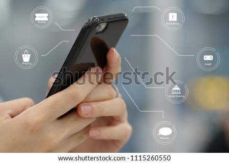 woman hand, playing and doing transaction via Smartphone. the picture of mobile is connected to many icons.