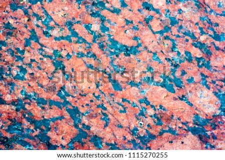 background texture, pattern. Granite tiles facing the city's buildings. a very hard, granular, crystalline, igneous rock consist mainly of quartz, mica, and feldspar and often used as a building stone