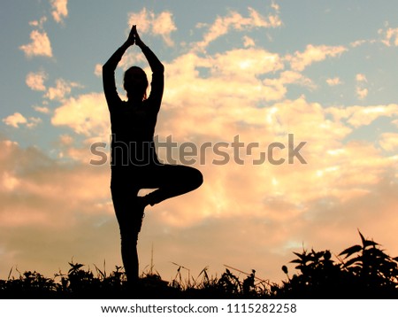 Yoga practicing emotional concept art. Silhouette on vintage tone sunset light. Surreal Twilight colorful, vintage filter effect. Pastel tone, colors. Good looking background. Copy space. 
