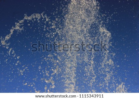Water splash with drops and lines on a background 