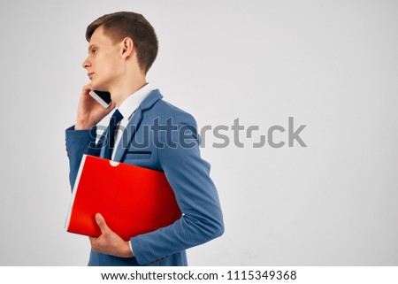 business man in suit, red folder                            