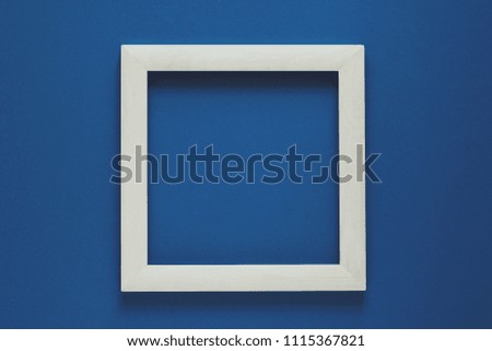Minimalism. Wooden frame decorated hibiscus flower. Top view. Flat lay. Mock-up. Toned