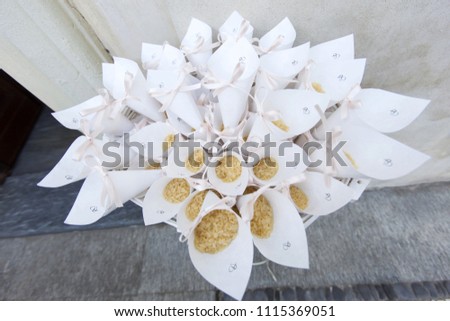Rice in paper tubes for sprinkling newlyweds