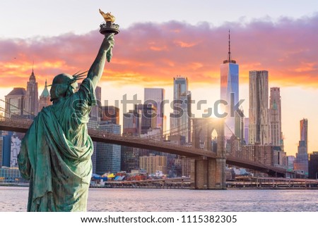 Statue Liberty and  New York city skyline at sunset,  in United States