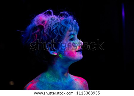 neon boy, neon colors on the face, fashion model boy in neon light, art design of kid disco posing in UV, colorful make up