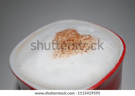 Cinnamon heart on coffee