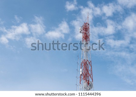 Telecommunication tower with antennas with blue sky. 