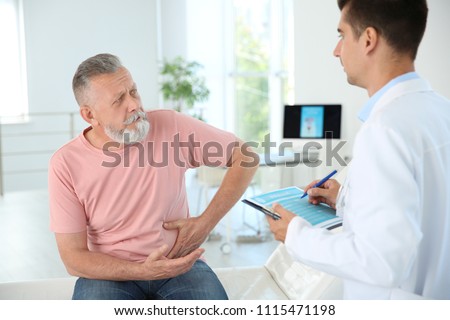 Man with health problem visiting urologist at hospital Royalty-Free Stock Photo #1115471198