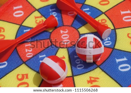 The game of darts, darts on the target, children game 