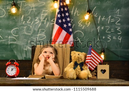 Happy students at the lesson with USA national flag. Enrichment classes can be difficult for some kids so tutors are best. Kids often learn easier by using images pictures and spatial understanding.