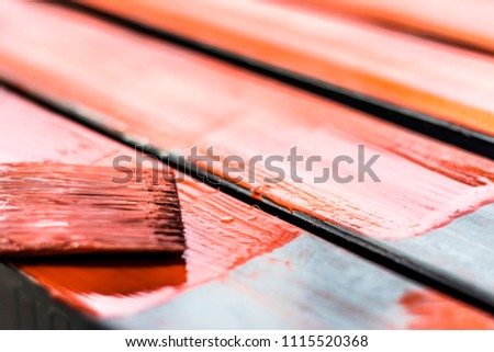 closeup of a color brush during the painting metal equipment   