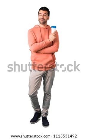 Full body of Man in a pink sweatshirt holding hot coffee in takeaway paper cup on isolated white background