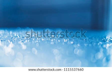 Blue glass with raindrops background texture horizontal top view isolated, rain on the window backdrop, abstract light bokeh and defocus drops, clear water on space blank back outdoors, mockup rainy