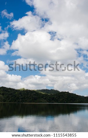 Landscape on lake with cloudy sky