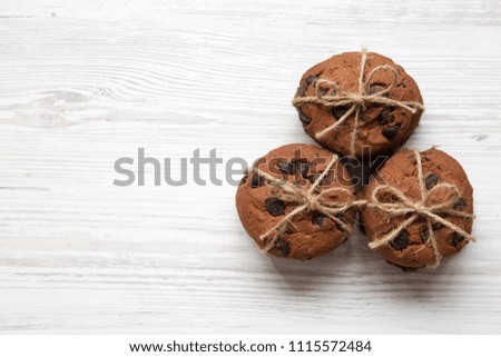 Chocolate chip cookies on a white wooden background, from above. Top view. Copy space.