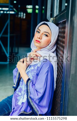 Happy muslim woman posing to the camera