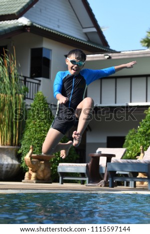 Healthy active boy in swimmimg wear activity.