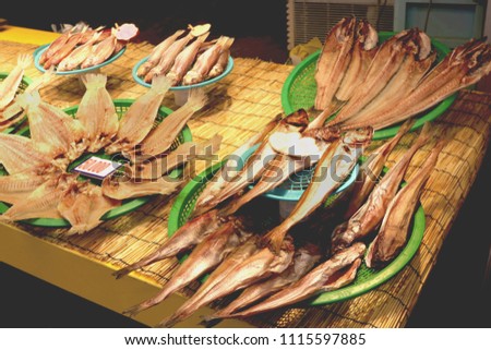 Dried fishes on display with price tag and name of fishes type at Dongmun Traditional market in Jeju Island,South Korea Royalty-Free Stock Photo #1115597885