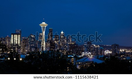 Skyline of city centre of Seattle, Washington, USA after sunset with Space Needle and skyscrapers Royalty-Free Stock Photo #1115638421