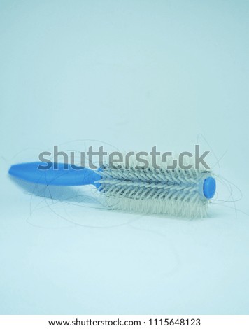 A picture of comb full with hair due to hair loss