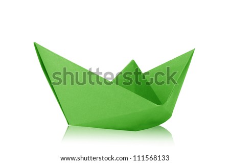 Close up origami green paper ship on white background.