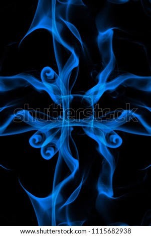 Smoke the blue incense on a black background. darkness concept