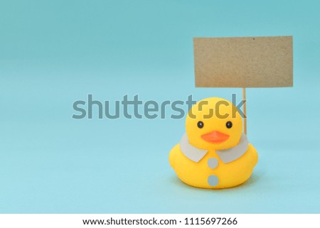 Feedback concept, rubber ducks are holding blank signboard.
