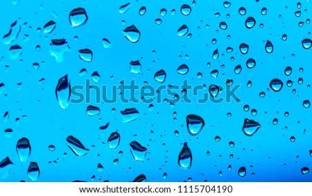 drops of water on a blue background. macro