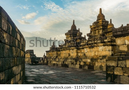 Dramatic view of ancient stupa borobudur temple with Mount Merapi in background. the world's largest Buddhist temple and UNESCO World Heritage Site. Magelang, Yogyakarta,Central Java, Indonesia