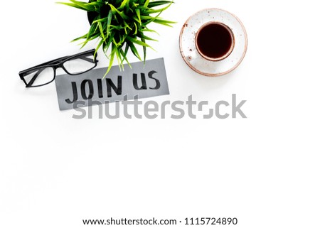 Template for socail media links. Hand lettering Join us on work desk with glasses, coffe, plant on white background top view copy space