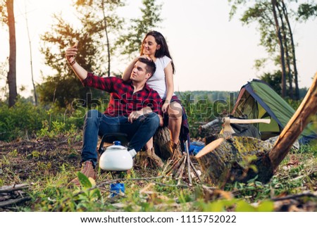 Happy couple on camping having fun together