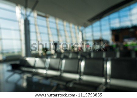 Blurred waiting chairs zone in airport or bus station. Royalty high-quality free stock image of bench in the terminal of airport , waiting area with chairs
