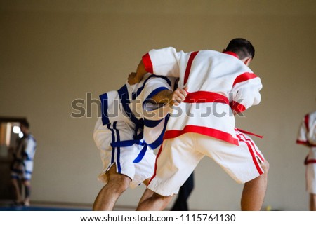Fight of two athletes Asian Kuresh fight on the mat Royalty-Free Stock Photo #1115764130