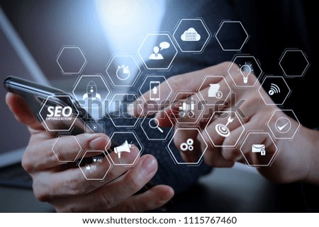 Seo Optimization for website with mobile website and Landing page virtual diagram.businessman hand working with mobile phone and laptop and digital tablet computer in modern office 