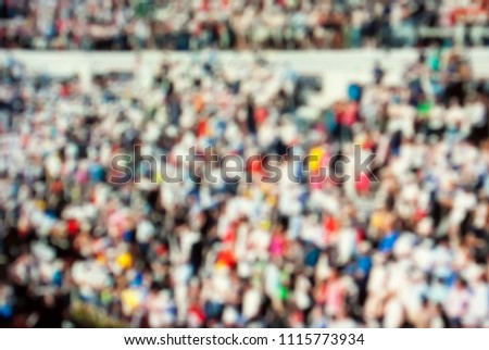 A lot of fans on a tennis match