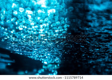 Water drop in sunlight background blue light, nature background free copy space.