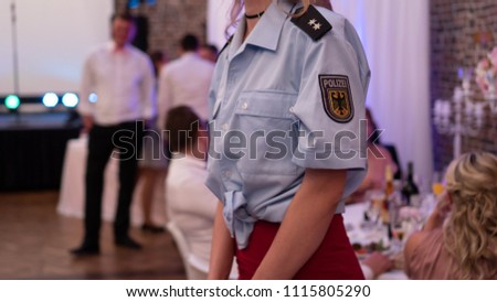 German police officer woman in the Red skirt on Wedding Event