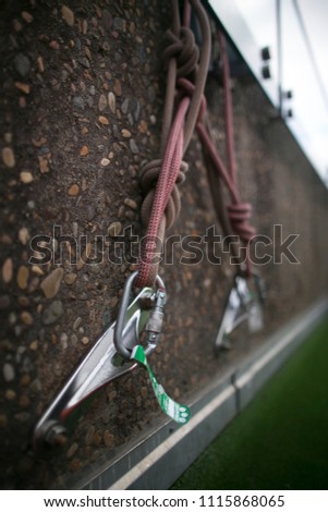 Picture side view of industrial rope access fall arrest, abseiling stainless approve certifies anchor point green tag, rigging as Y hang anchor point system on concrete wall at construction sit Sydney