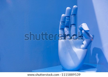 A hand of blue wood doll make okay at the studio.Thailand