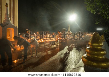Take photo long exposure technique.In thailand. Thai people holding candlesVisakha Puja Day