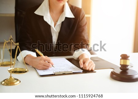 Judge gavel Justice lawyers, Business woman in suit or lawyer working on a documents. Legal law, advice and justice concept.
