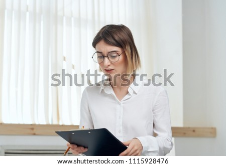 Business woman looking at documents                              