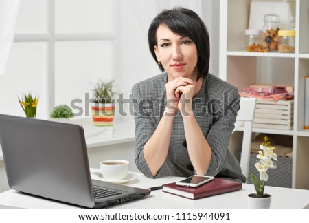 portrait of a business woman in a white interior