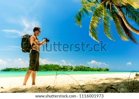 People make professional photo on the tropical beach