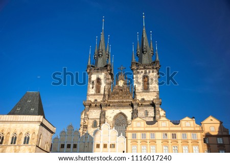 Magnificent spires and facade of the Church of Our Lady before Týn, Prague, Czech Republic. Dramatic gothic architecture with a deep blue sky background