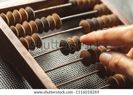 Vintage abacus close up Royalty-Free Stock Photo #1116018269