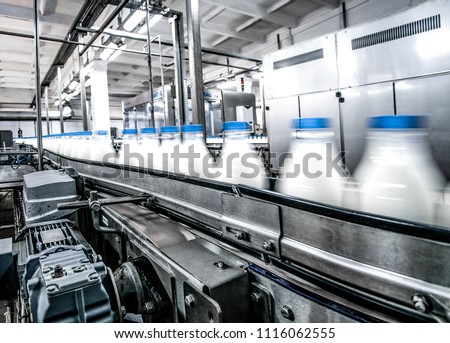 Milk production on line at the factory Royalty-Free Stock Photo #1116062555