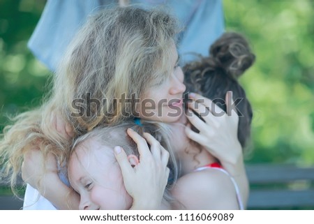 daughter kisses mom / happy family mom and daughter kiss, concept of female happiness, beautiful mother and daughter 5 year old kiss